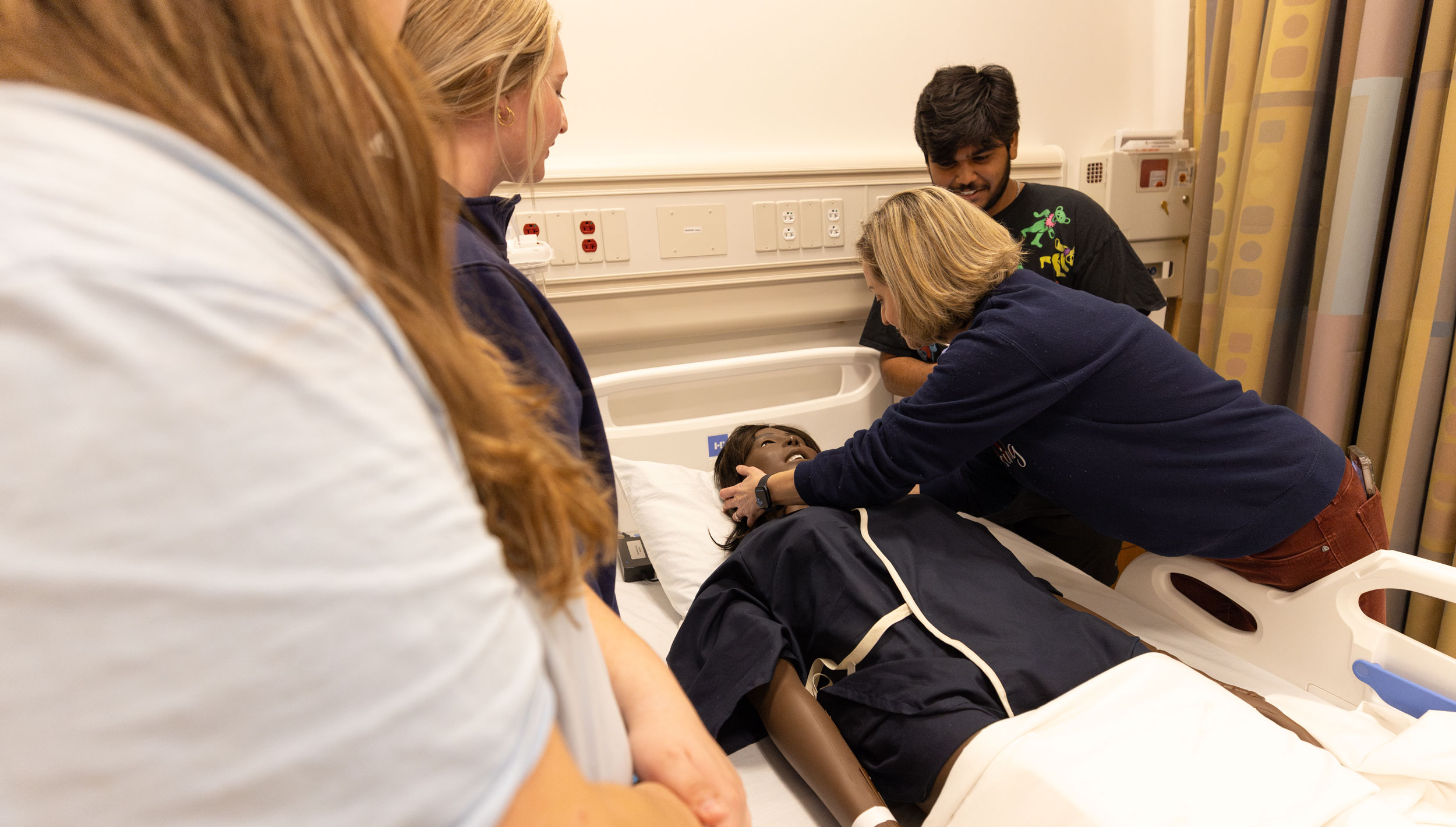 Students working in nursing skills lab