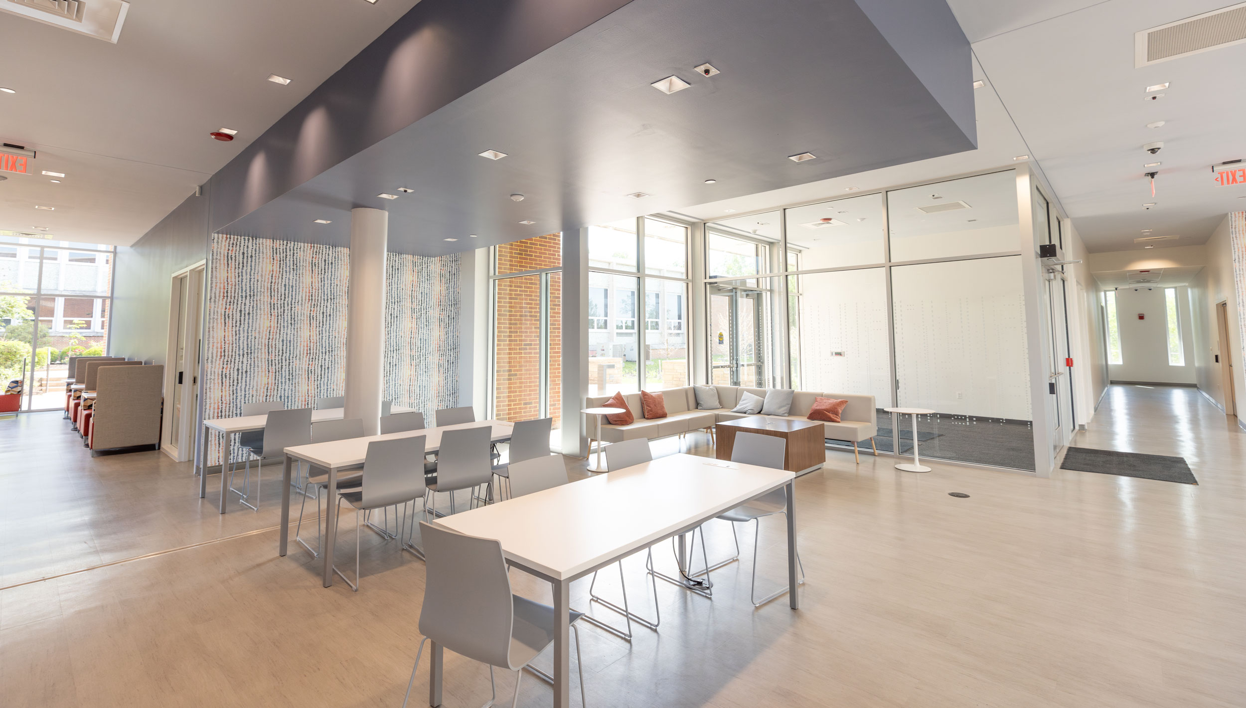 Empty lobby of Pippin-Wyllie Hall with tables and chairs