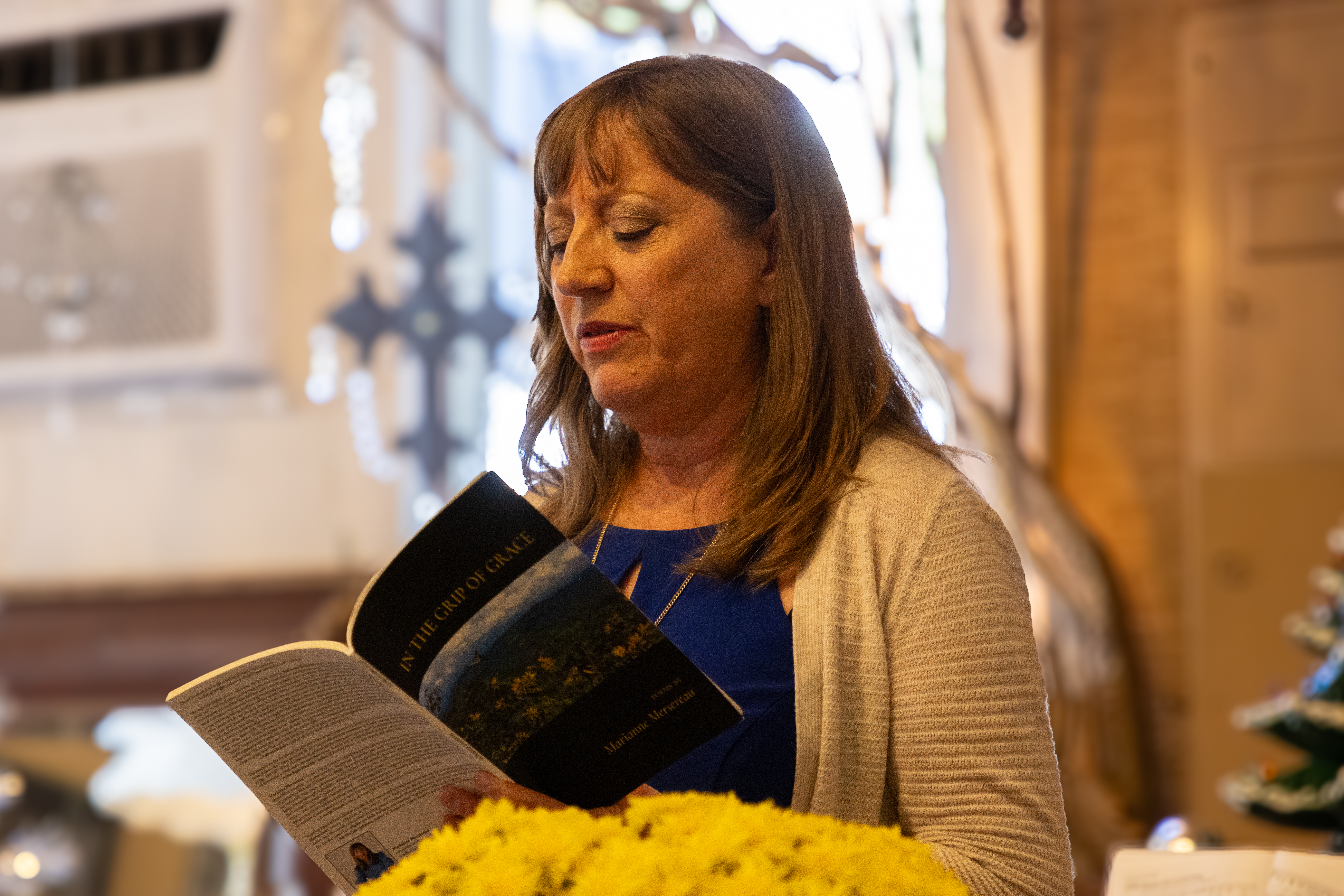 Woman reading a book aloud