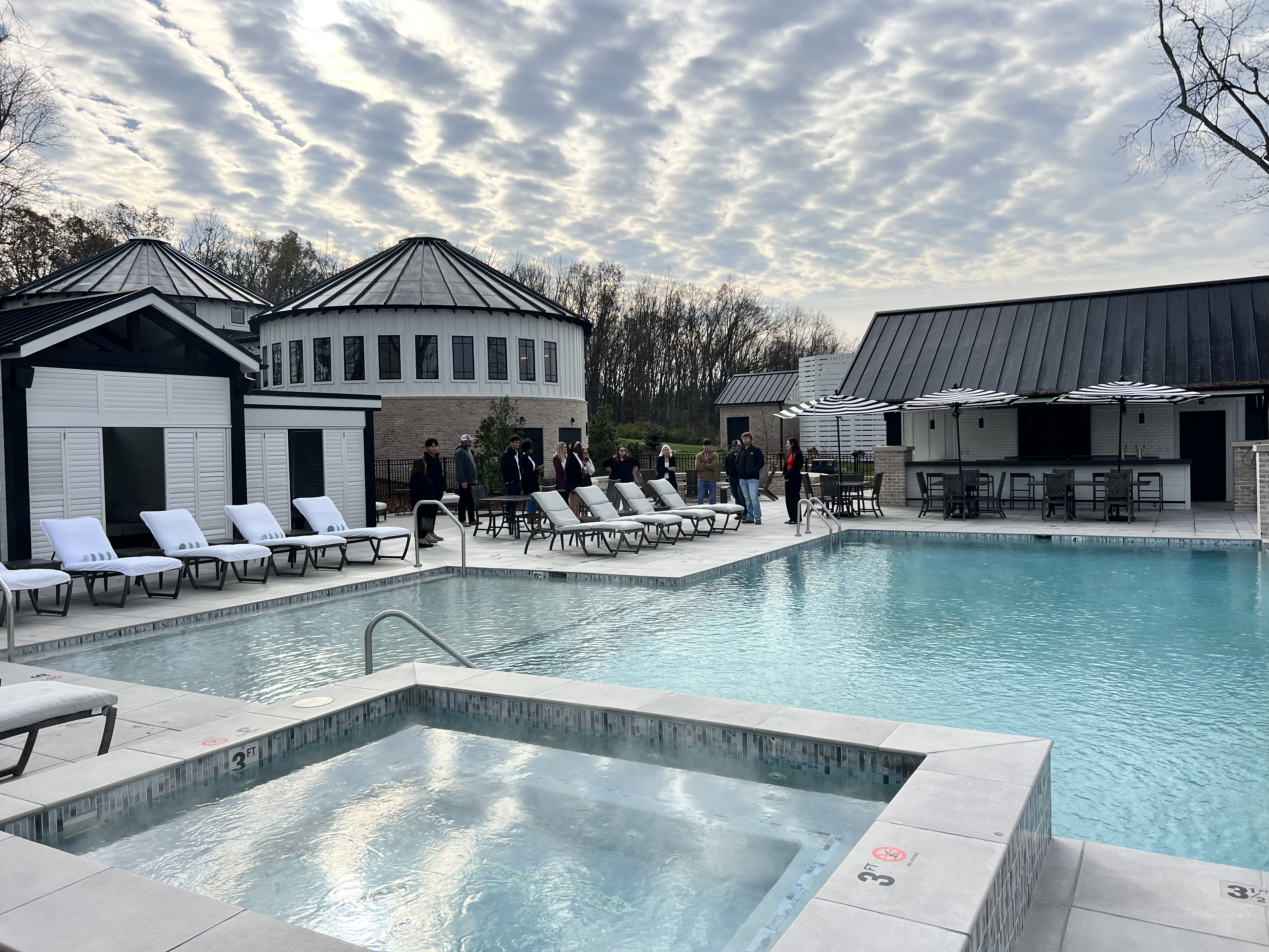 Group of students working by pool