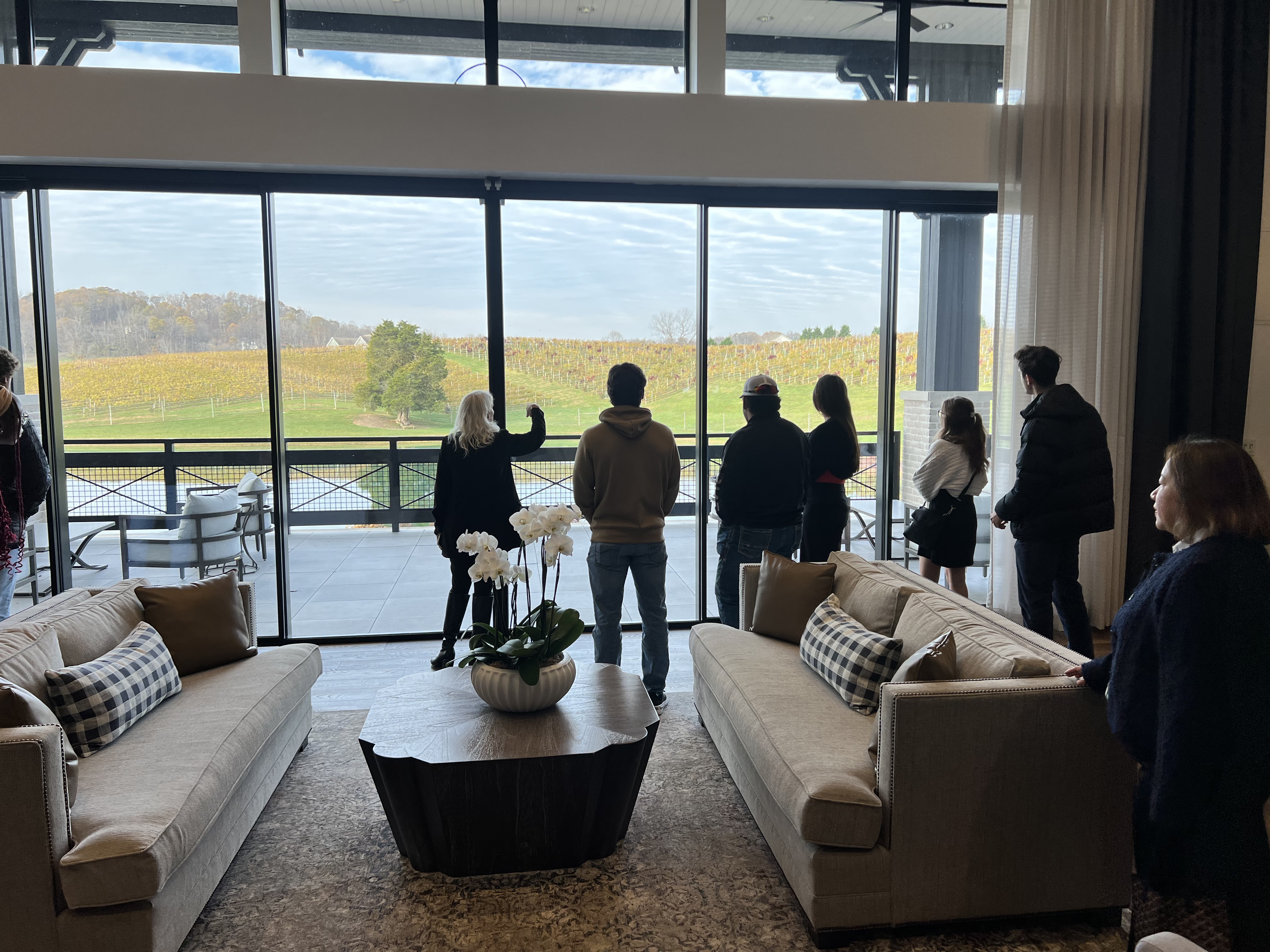 Group of students standing by window