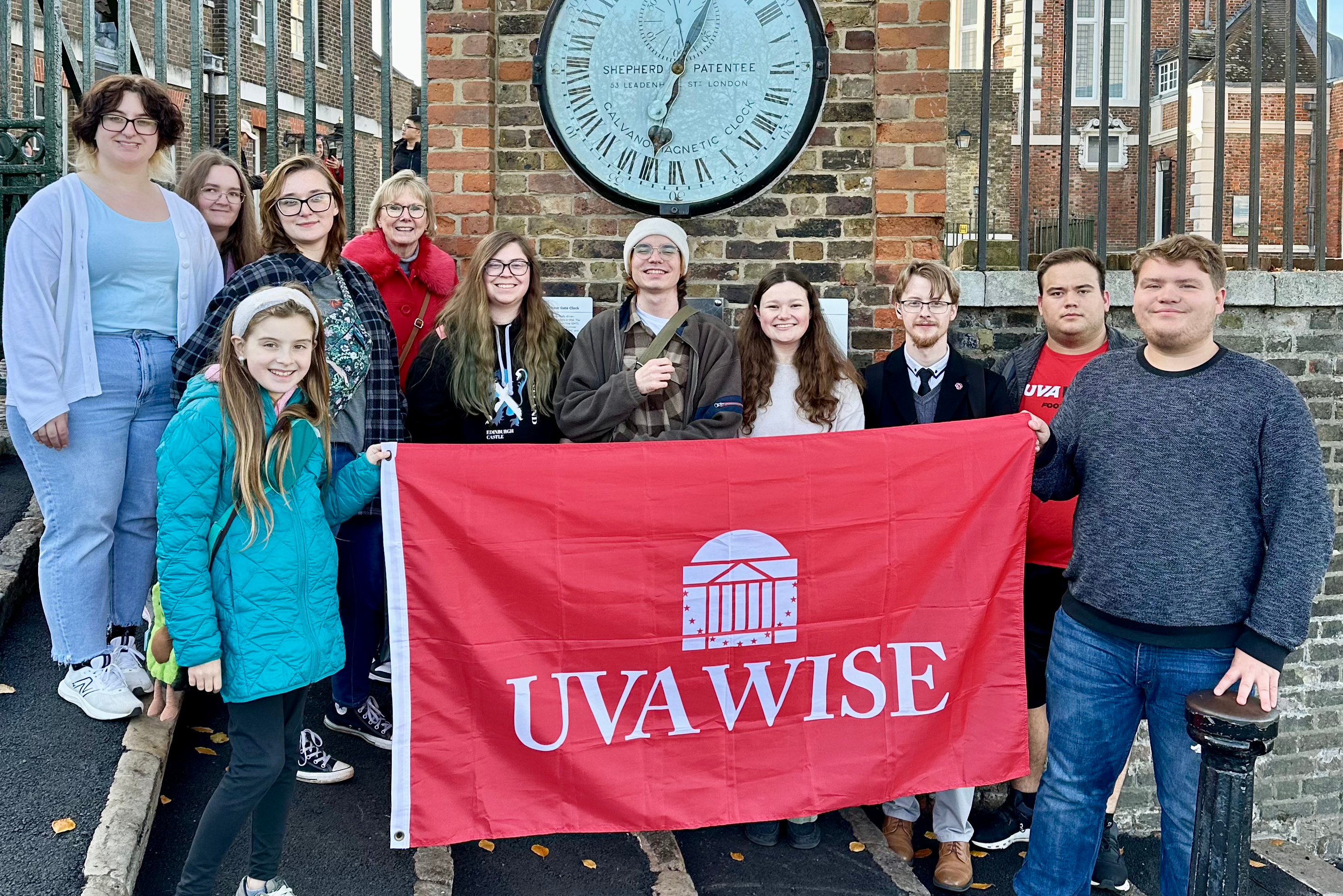 Group of students posing with UVA Wise flag