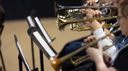 Students playing trumpets