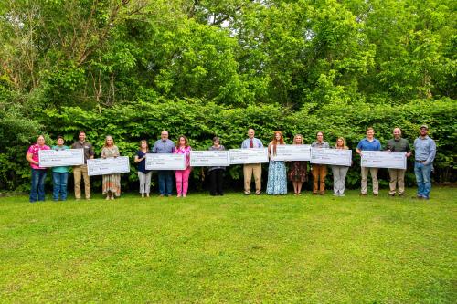 2024 award recipients of the Cumberland Forest Community Fund with their checks