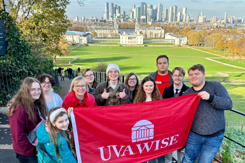 Group of students posing with UVA Wise flag