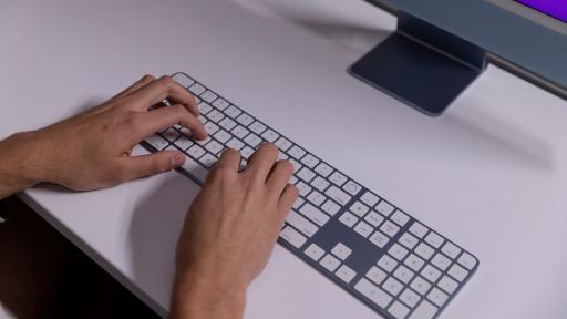 Hands typing on keyboard