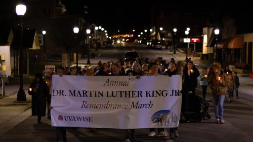 People with banner walking