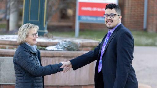 Student Henry and Chancellor Colón Rodríguez switch places